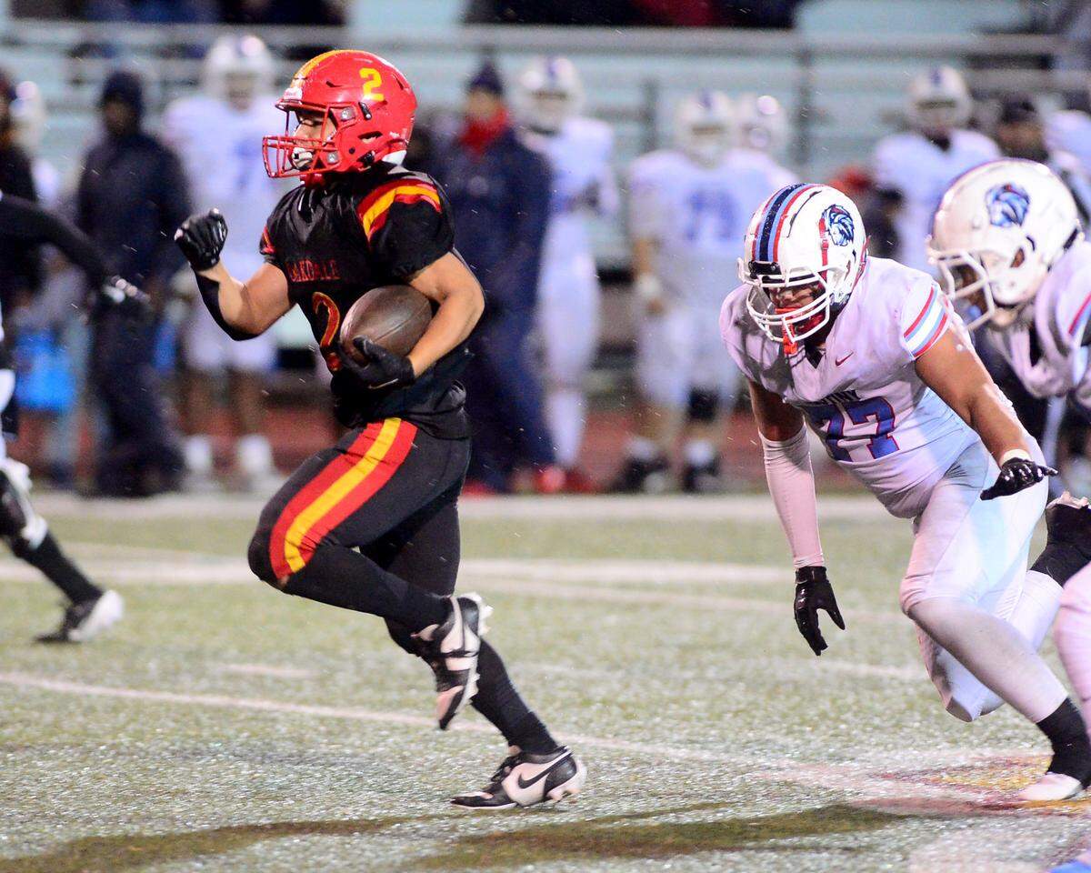 Oakdale running back Richard Flores (2) breaks away to score a touchdown during a 2024 CIF Sac-Joaquin Section Division 3 playoff game between Oakdale High School and Destiny Christian Academy at Oakdale High School in Oakdale California on November 22, 2024. Oakdale won the game 49-35.