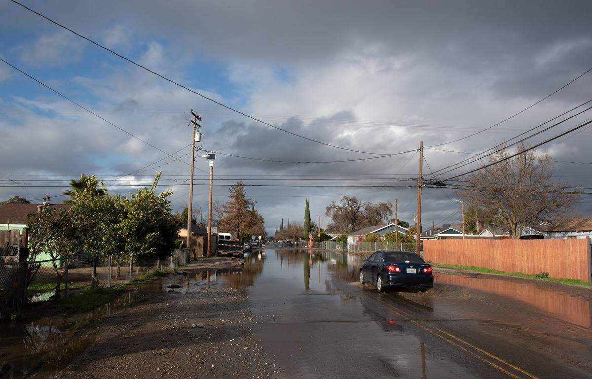 Street flooding from the recent storm has been a problem for residents in south Modesto, Calif., Tuesday, Jan. 10, 2023.
