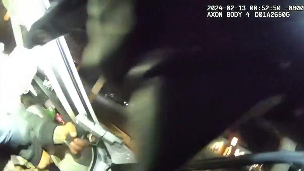 A still from bodycam video shows a suspect later identified as Mark Coke Jr. pointing a handgun toward Modesto police officers early Feb. 13, 2024, in west Modesto. Coke was wounded when two officers discharged their firearms.