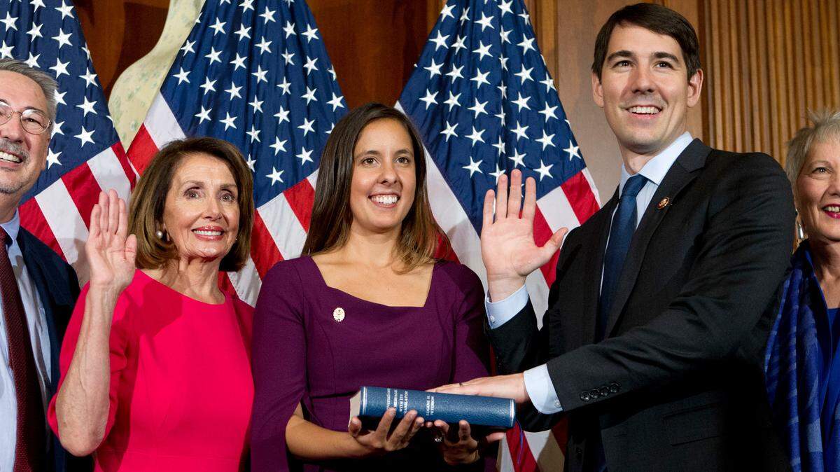 House Speaker Nancy Pelosi of Calif., administers the House oath of office to Rep. Josh Harder, D-Calif., during ceremonial swearing-in on Capitol Hill in Washington, Thursday, Jan. 3, 2019, during the opening session of the 116th Congress. (AP Photo/Jose Luis Magana)
