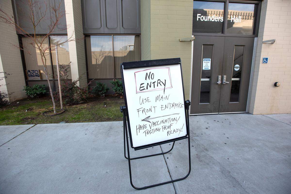 Students are being screened before entering classes at Modesto Junior College in Modesto, Calif., on Tuesday, Jan. 11, 2022.