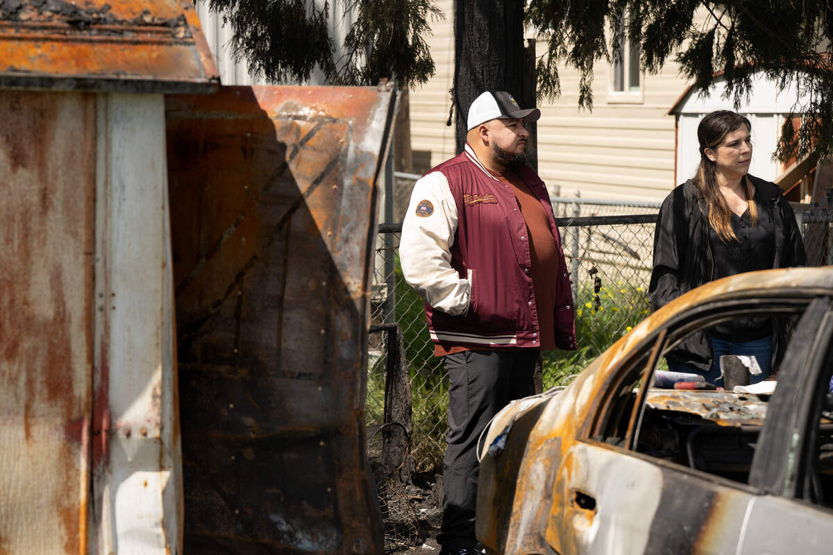Ceres Mayor Javier Lopez and Councilmember Cerina Otero, right, visit the site of a deadly fire at the Lazy Wheels mobile home park in Ceres, Wednesday, April 2, 2025.