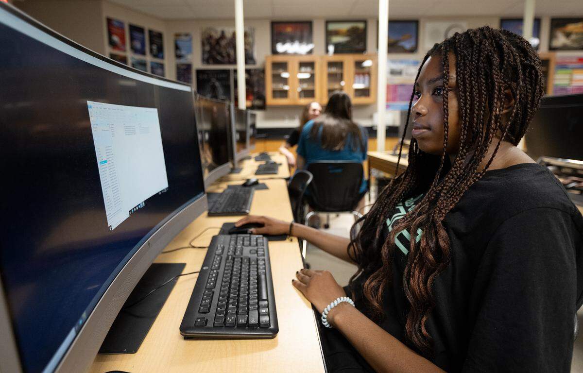 Enochs senior Grace Leba works on a cybersecurity challenge during a computer science Hackathon at Enochs High School in Modesto, Calif., Saturday, May 11, 2024.