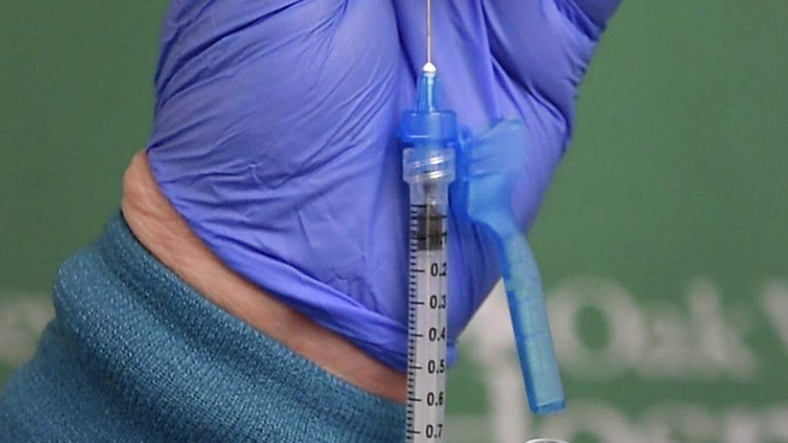 Nurse Regina Singh prepares the COVID-19 vaccine at Oak Valley Hospital in Oakdale, Calif., Friday, Dec. 18, 2020.