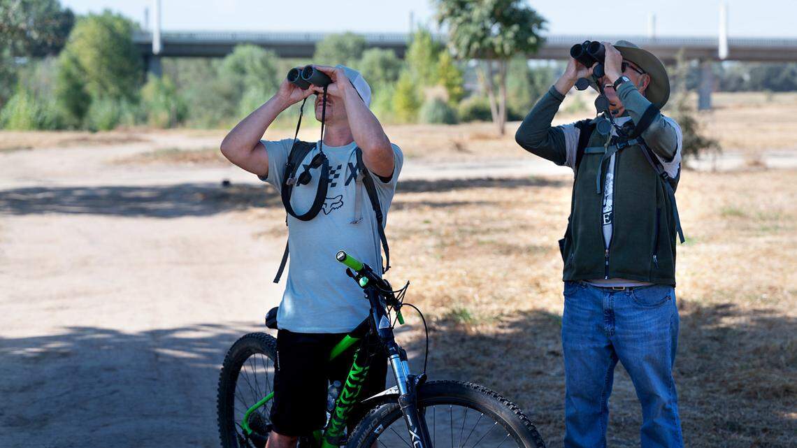 Gusty Souza, left, and Daniel Gilman from Stanislaus Audubon Society look at birds during the 2023 Modesto RecFest.