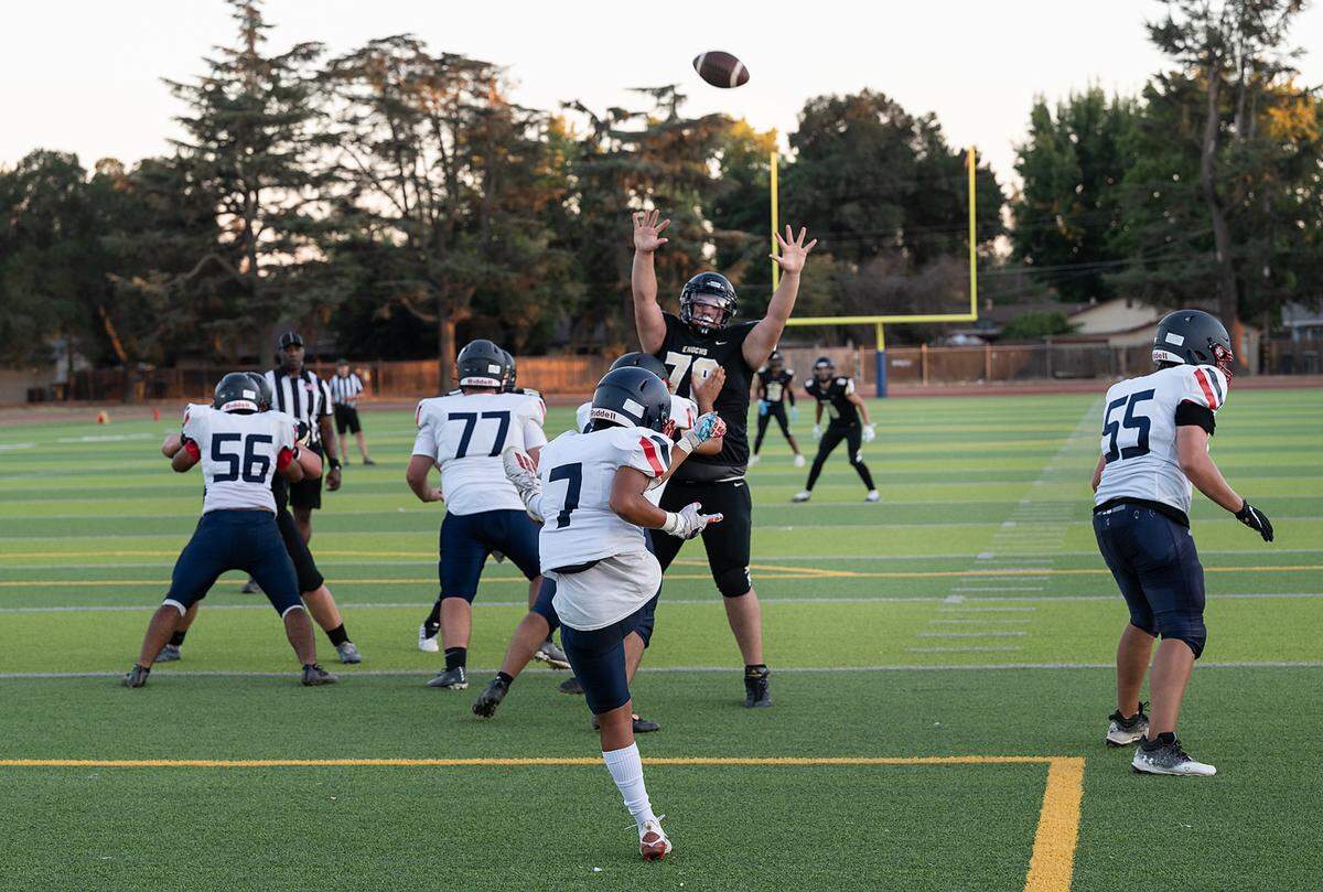 Beyer’s punter Marcus Pandey kicks from the end zone during Friday’s game with Enochs at Downey High School in Modesto, Calif., on August 19, 2022.