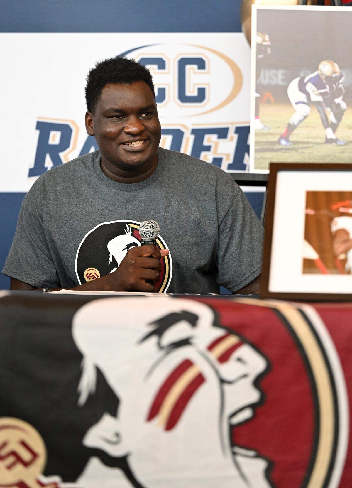 Central Catholic’s Manasse Itete speaks to the crowd gathered during a National Signing Day ceremony at Central Catholic High School in Modesto, Calif., Wednesday, Dec. 20, 2023. Itete signed to play football at Florida State University.