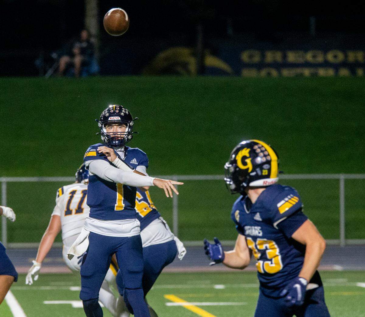 Conner Bailey, 1, of Gregori passes to Michael Marsden, 23, as they work to gain yards on Turlock High Thursday Sept. 28, 2023.