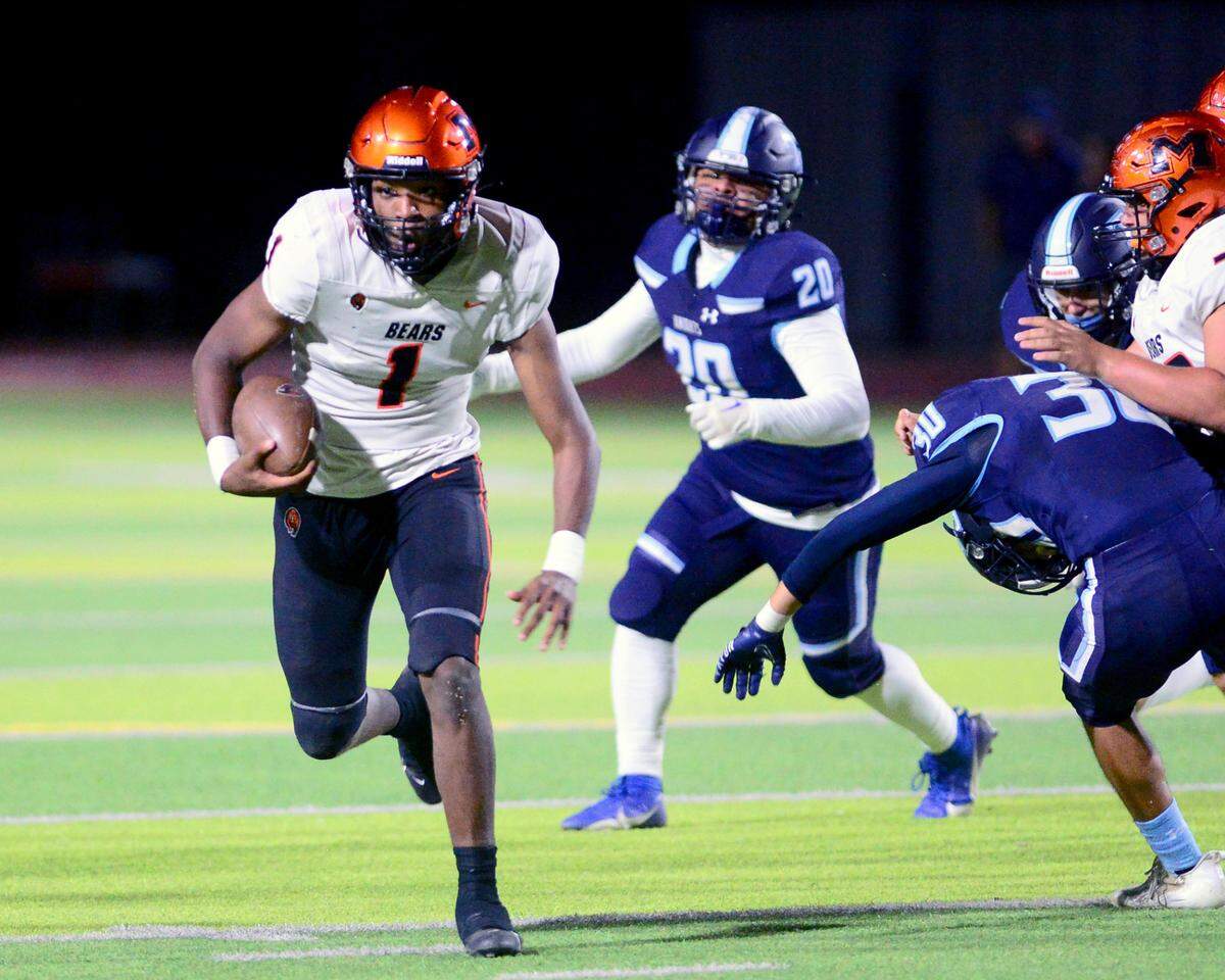 Merced quarterback Quintell Dupress (1) scrambles during a game between Downey High School and Merced High School at Downey High School in Modesto California on September 1, 2023.