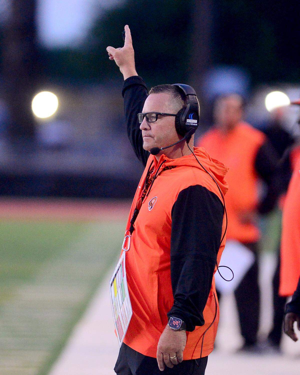 Merced Head Coach Rob Scheidt calls a play during a game between Patterson High School and Merced High School at Patterson High School in Patterson California on August 23, 2024.