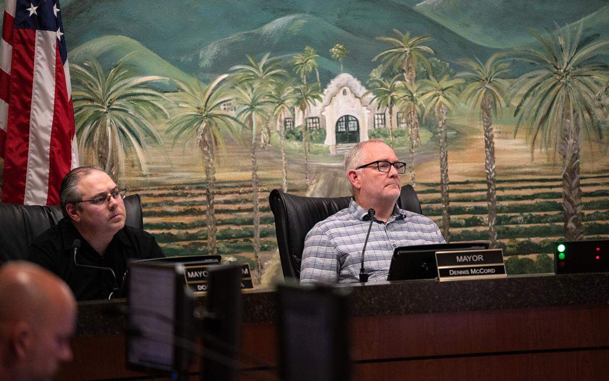 Patterson mayor Dennis McCord, right, and Mayor Pro Tem Dominic Farinh, left, listen to public comment during the council meeting at Patterson City Hall in Patterson, Calif., on Tuesday, April 5, 2022.