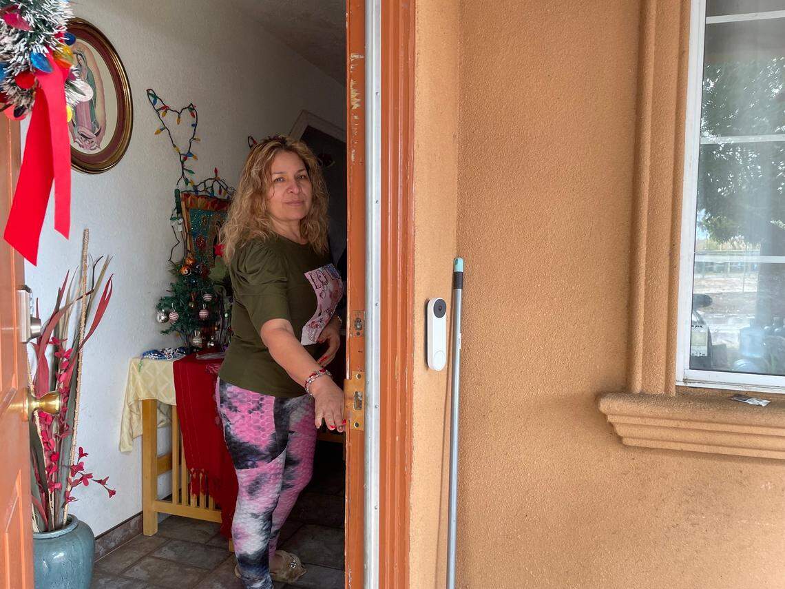 Petra Cerna stands at the entrance to her home in Riverdale Park, located in one of the high risk flood zones. She doesn’t have flood insurance. After she bought the home, she learned that her house flooded in 1997, bringing water to the height of her doorknob.
