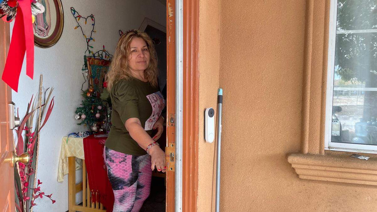 Petra Cerna stands at the entrance to her home in Riverdale Park, located in one of the high risk flood zones. She doesn’t have flood insurance. After she bought the home, she learned that her house flooded in 1997, bringing water to the height of her doorknob.