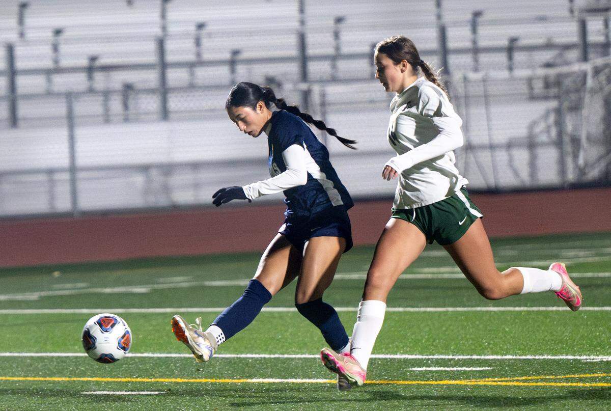Gregori’s Grace Rodriguez scores a goal on a fast break as Pitman Jazmine Wolfe-Hunnicutt defends during the Central California Athletic League game at Gregori High School in Modesto, Tuesday, Jan. 13, 2026. 