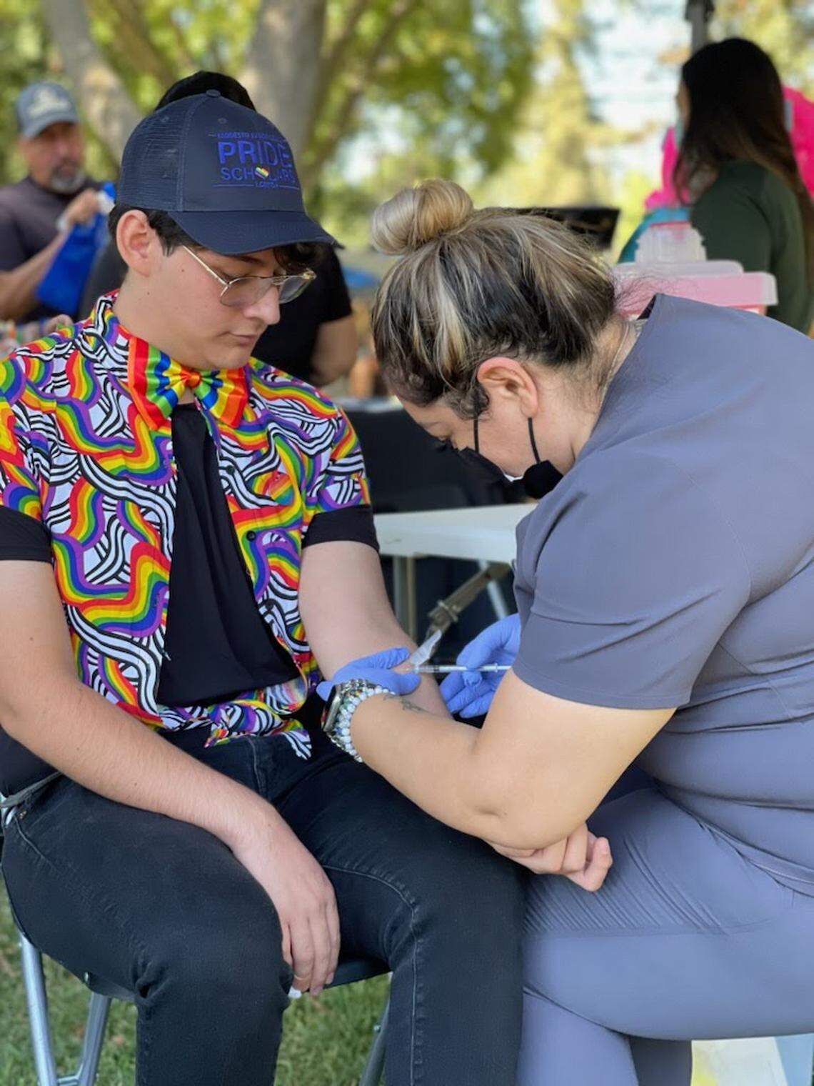 A nurse from Golden Valley Health Center administers a dose of the monkeypox vaccine to Joshua Carrillo.
