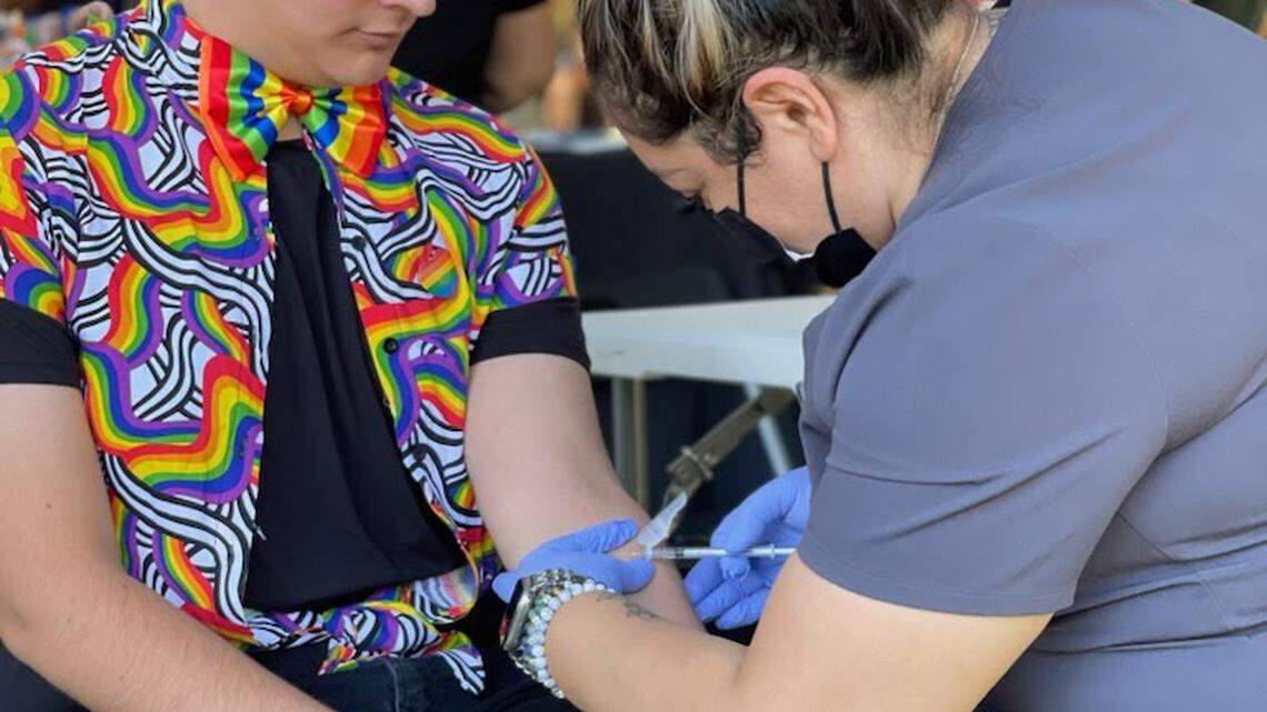 A nurse from Golden Valley Health Center administers a dose of the mpox vaccine to Joshua Carrillo.