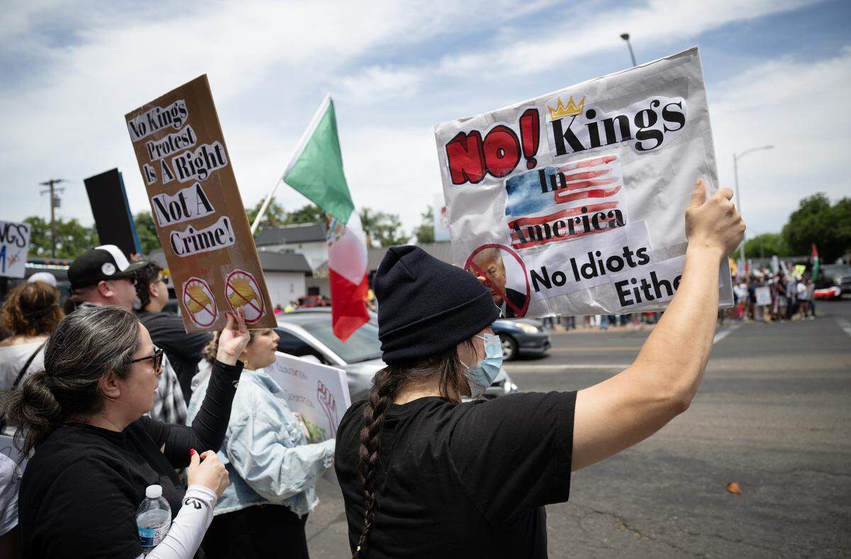 “No Kings” protestors rallied at Five Points to oppose Trump Administration policies at Graceada Park in Modesto, Saturday, June 14, 2025.