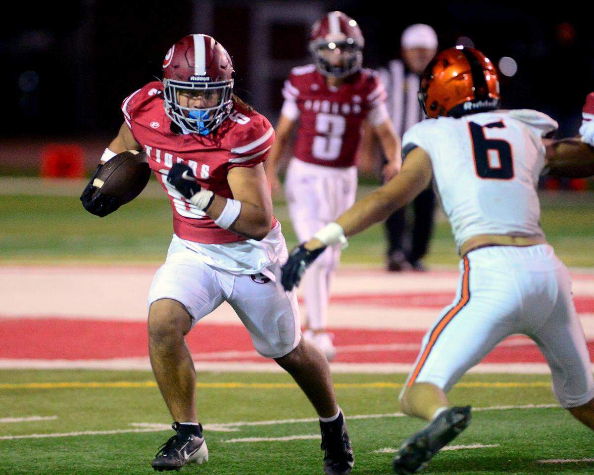 Patterson running back Ty Todd (6) eyes a Merced defender during a game between Patterson High School and Merced High School at Patterson High on Aug. 23, 2024.