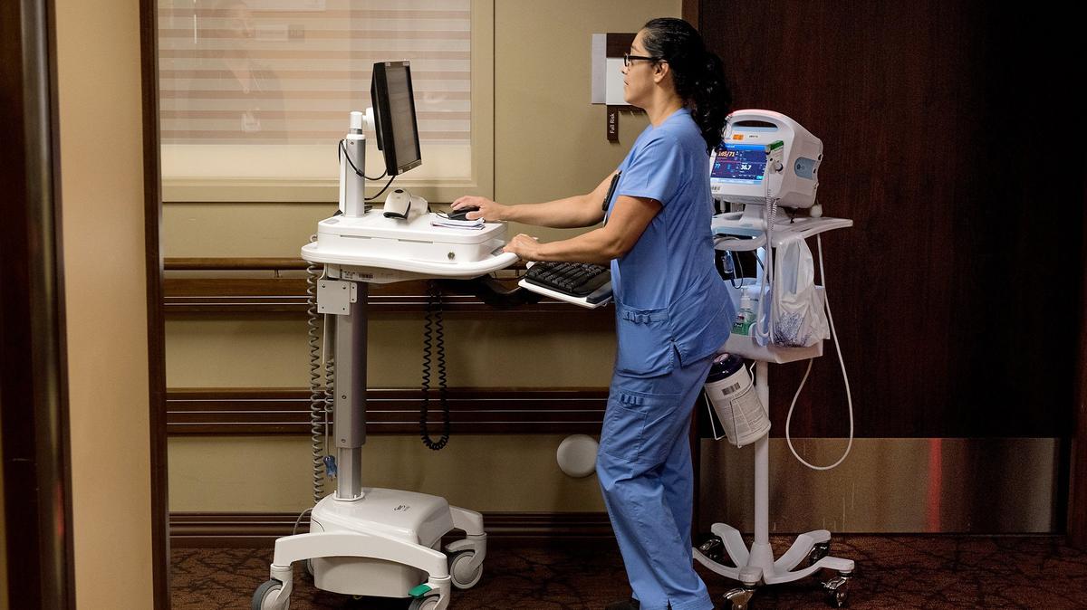Nurse assistant Christina Torrez works on a patient’s chart at work at Doctors Medical Center in Modesto, Calif., on Tuesday, April 17, 2018.