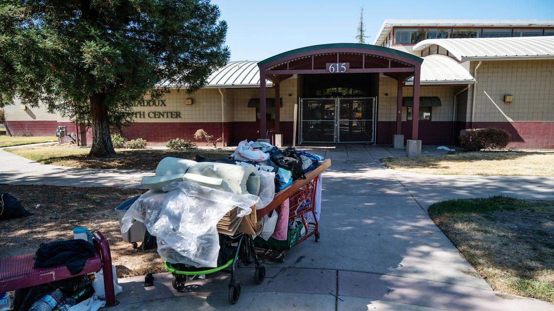 Homeless belongings outside Maddux Youth Center at Cesar Chavez Park in Modesto, Calif., on Wednesday, Sept. 29, 2021.