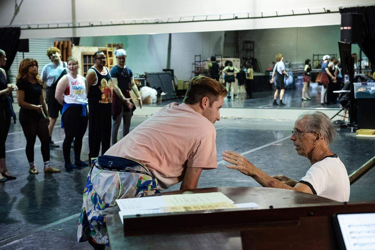 Modesto Performing Arts actor Grant Landon, left, and director Paul Tischer discuss a scene during rehearsal of “A Chorus Line” in Modesto, Calif., on Thursday, May 26, 2022.