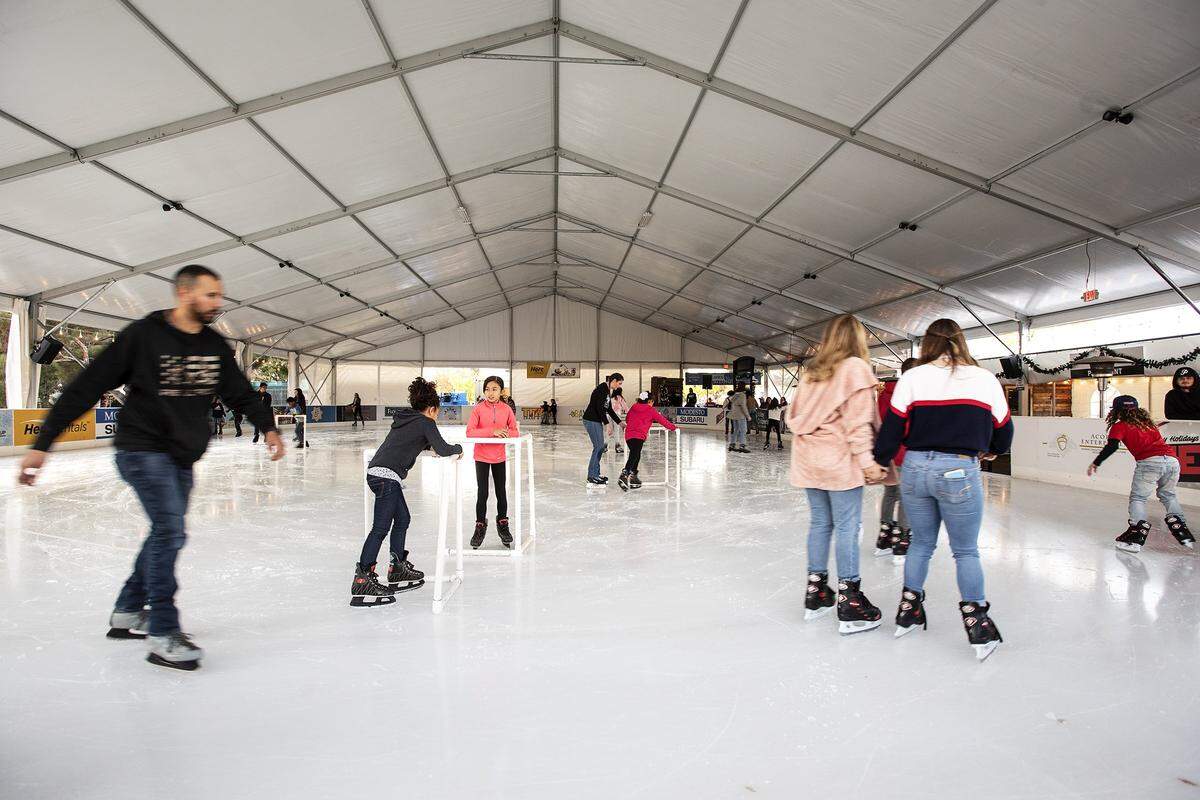 People skate on opening day of Modesto On Ice in Downtown Modesto, Calif., Saturday, Nov. 23, 2019.