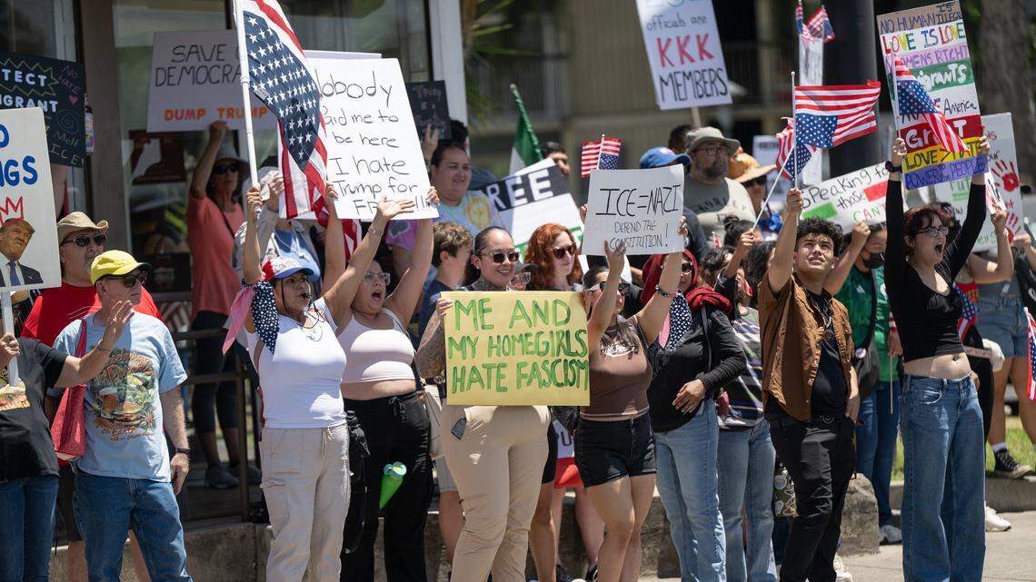 “No Kings” protestors rallied at Five Points to oppose Trump Administration policies at Graceada Park in Modesto, Saturday, June 14, 2025.  