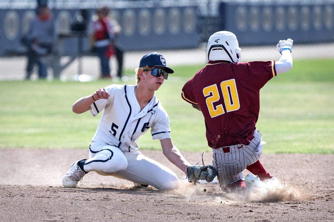 Central Catholic shortstop AJ Milligi tags out Los Banos runner Jayten Walton during the first round of the Sac-Joaquin Section playoffs at Central Catholic High School in Modesto, Calif., Tuesday, May 9, 2023. The Raiders won the game 4-0.