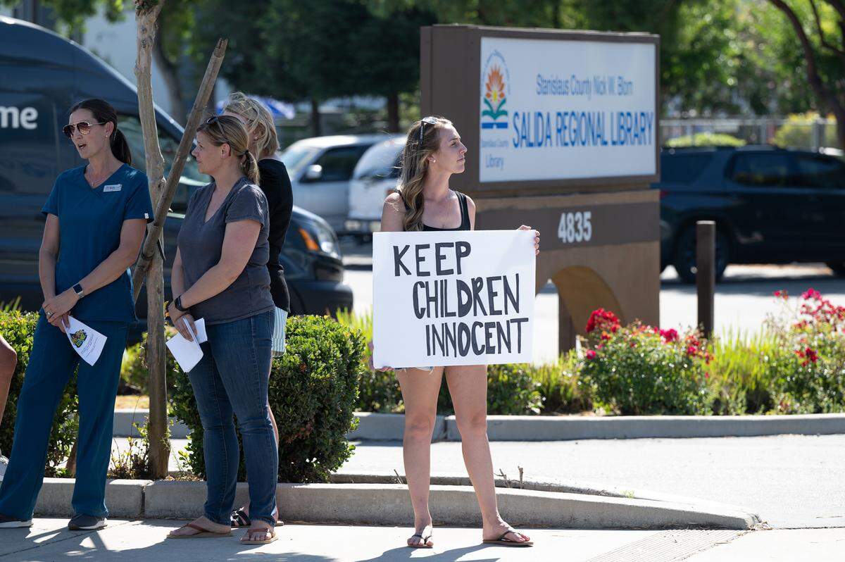 A group gathered outside Salida Library to show their opposition to Rainbow Story time at the Stanislaus County Library in Salida, Calif., Thursday, June 15, 2023.