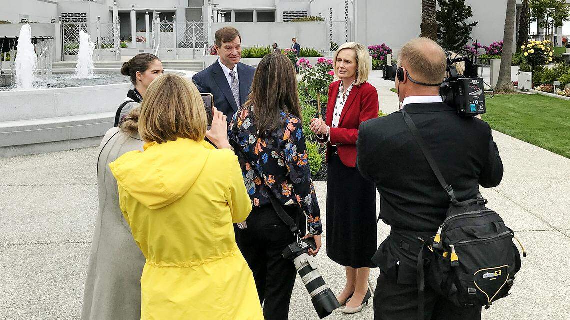 Bonnie Cordon (in red) is interviewed by media on Monday, May 6, 2019 in front of the newly refurbished Oakland Temple of the Church of Jesus Christ of Latter-day Saints. She is president of the church’s organization for young women