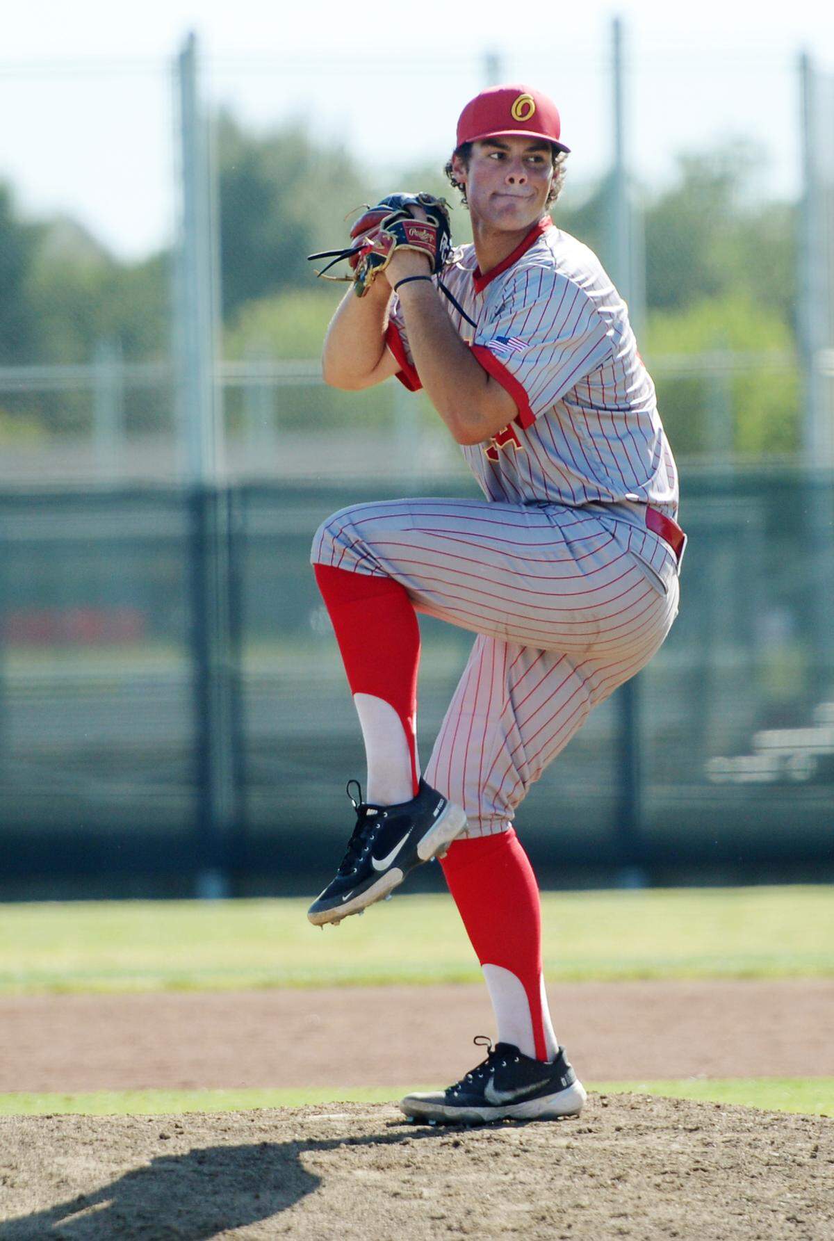 Oakdale pitcher Landon Schutte delivers a pitch during the CIF Sac-Joaquin Section Quarterfinals against Vista del Lago at Oakdale High School on May 9, 2024. Oakdale won 10-5.