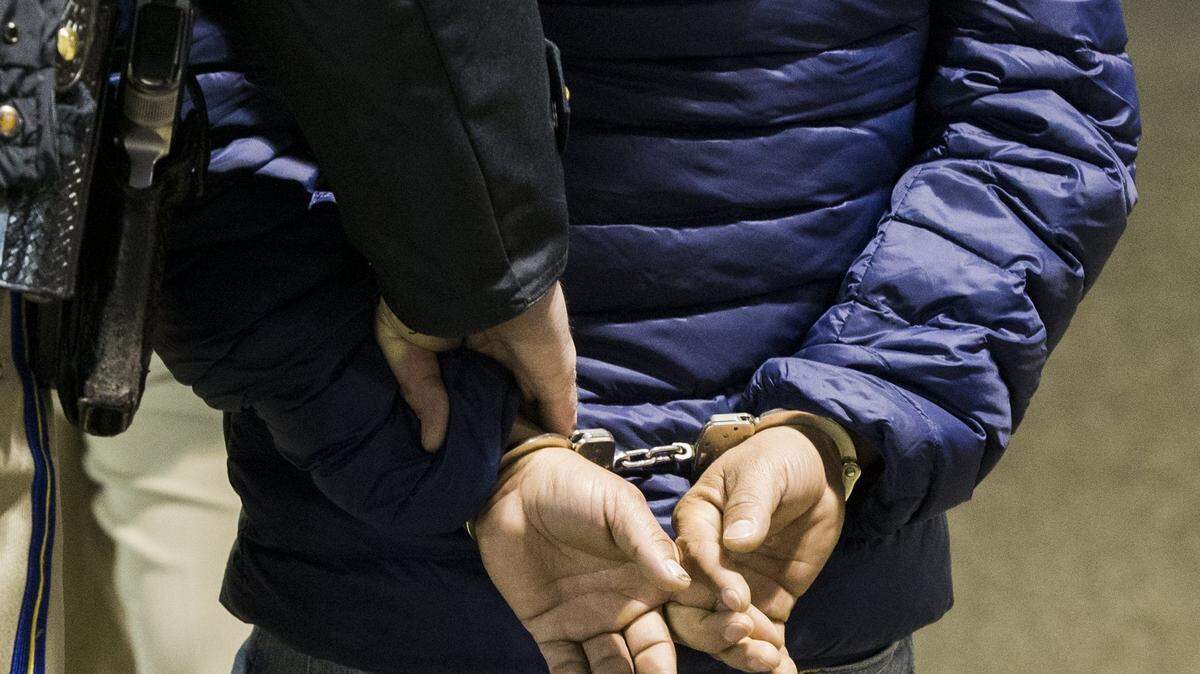 A suspected DUI driver is handcuffed and taken to a patrol car after failing a sobriety test at a CHP checkpoint in north Modesto in December.