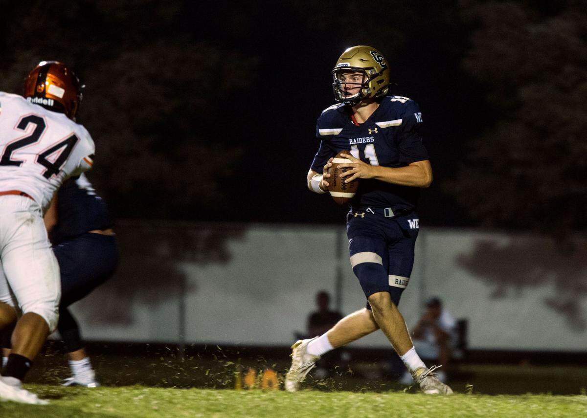 Central Catholic’s Tyler Wentworth looks upfield for an open man during the Raiders’ game against Merced on Friday, Aug. 20, 2021.
