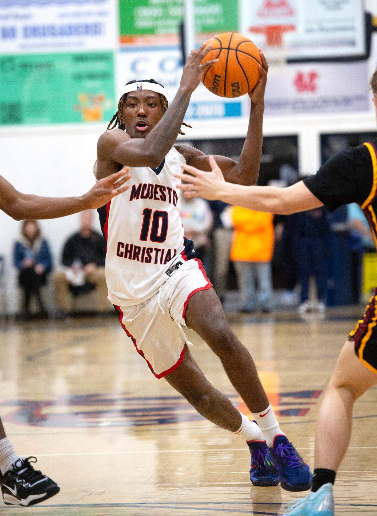 Modesto Christian’s BJ Davis drives to the basket in the Modesto Christian Holiday Hoop Classic championship game with Clovis West at Modesto Christian High School in Salida, Calif., Friday, Dec. 30, 2022. MC won the game 79-55.