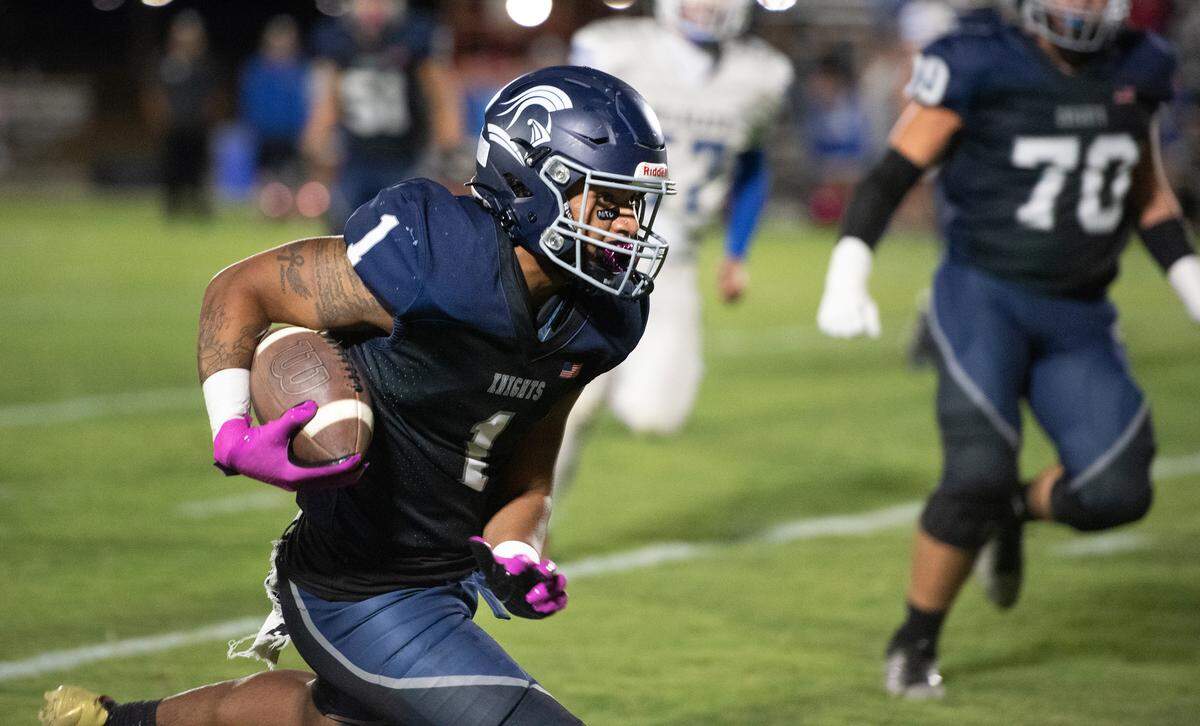 Stone Ridge Christian senior Daijon O’Neil breaks free on a run during the Knights’ 48-16 homecoming win over Waterford on Friday night in Merced. O’Neil scored four touchdowns — three rushing and one receiving — to lead the way.