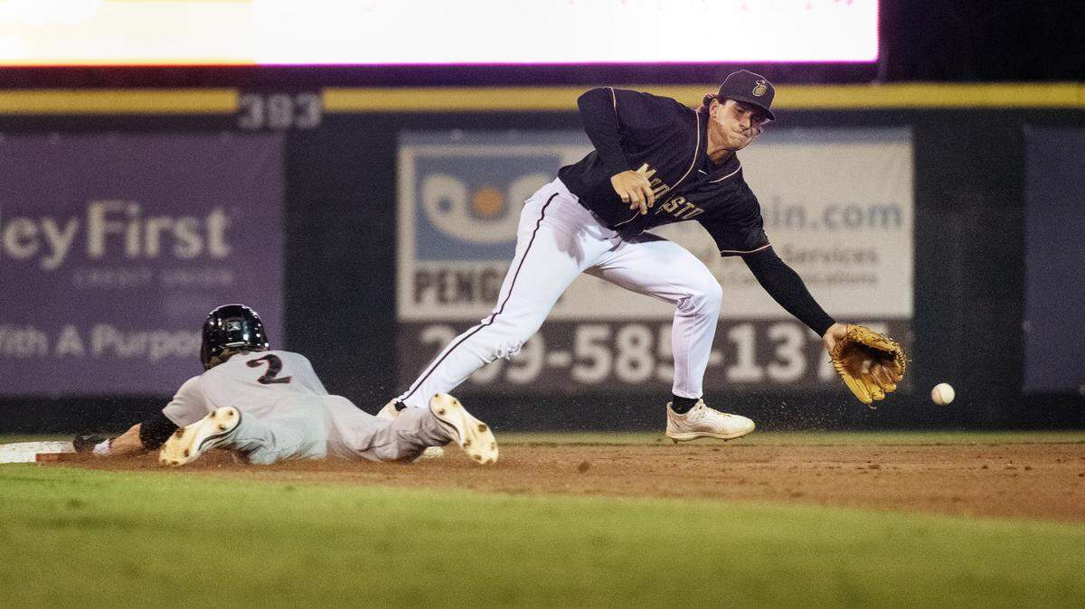 Lake Elsinore’s Brandon Butterworth steals second as Modesto Nuts’ Charlie Pagliarini reaches for an errant throw from catcher Josh Caron during the California League Championship game with Lake Elsinore at John Thurman Field in Modesto, Calif., Tuesday, Sept. 17, 2024. Nuts lost to the Storm 9-2. 