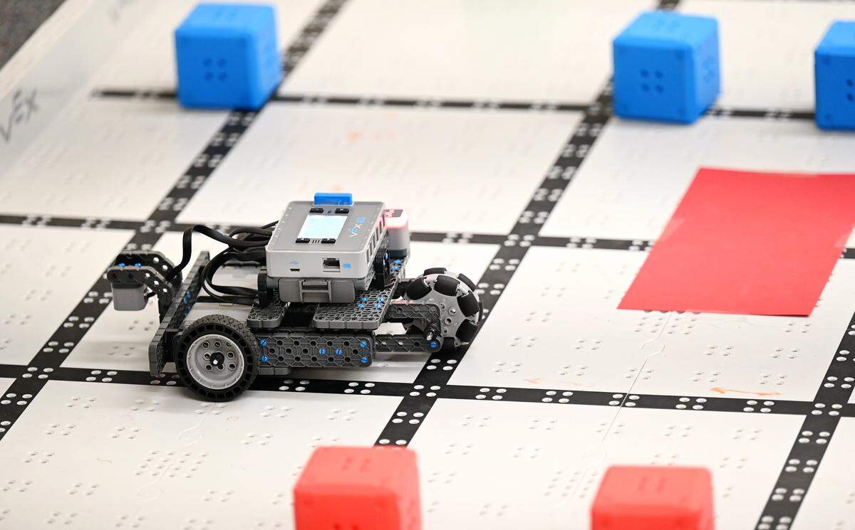 Fifth-grade students navigate at robot through a maze during STEM class at Tuolumne Elementary School in Modesto, Calif., on Thursday, Feb.17, 2022.