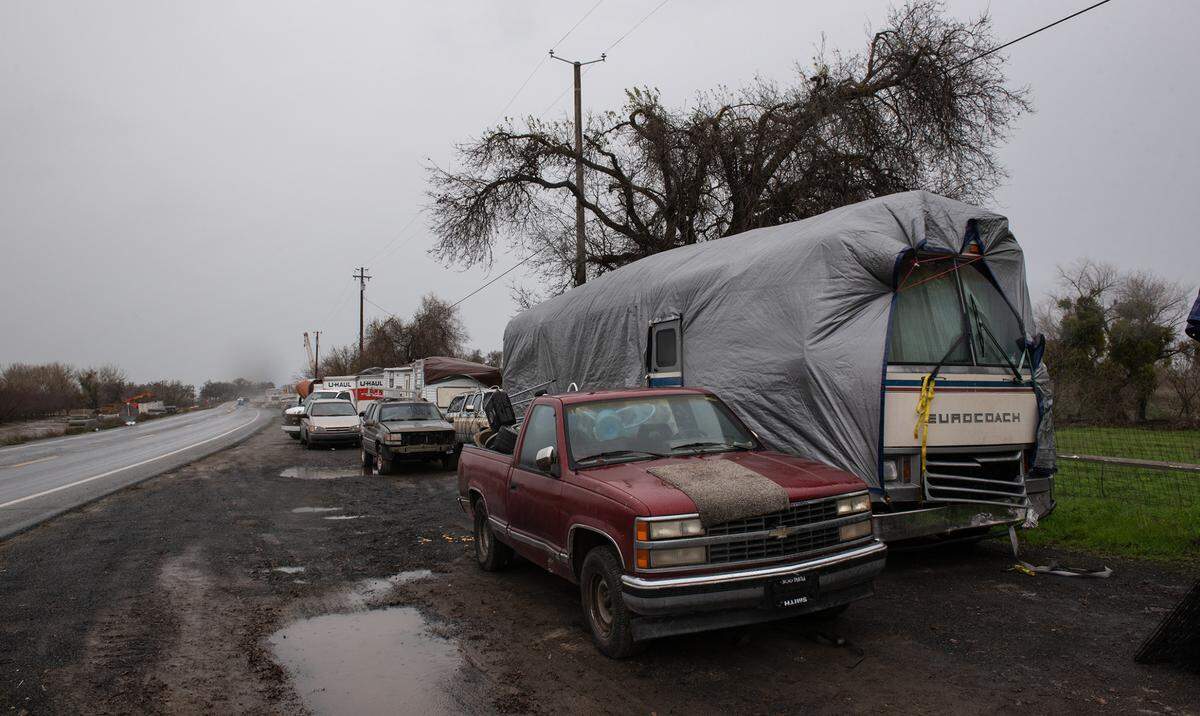Catfish Camp RV park residents have moved their trailers and RV’s up to Crows Landing Road as the San Joaquin River threatens to flood the park north of Newman, Calif., Wednesday, Jan. 11, 2023.