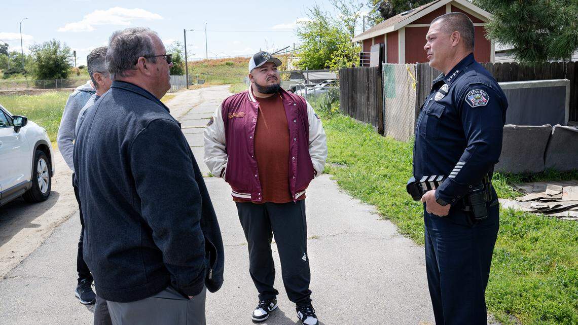 Ceres mayor Javier Lopez speaks with Ceres interim police chief Trenton Johnson, right, and city manager Doug Dunford, left, at the Lazy Wheels mobile home park in Ceres, Wednesday, April 2, 2025.