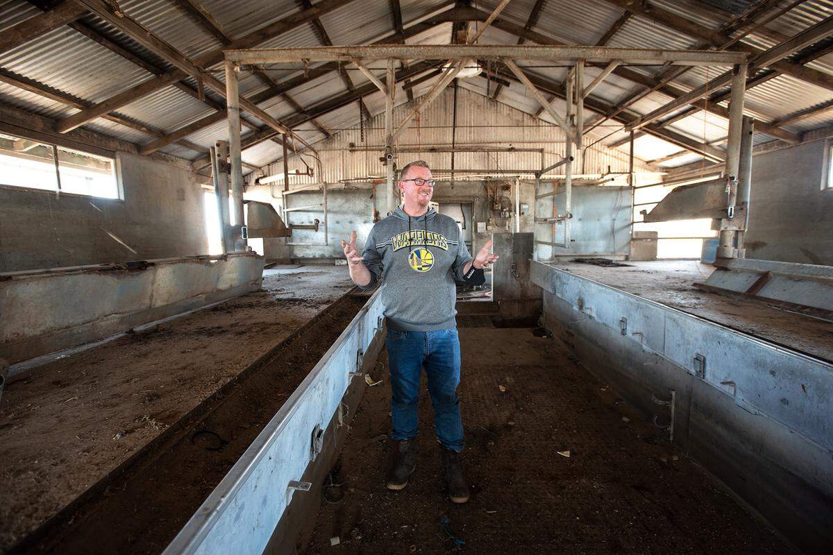 Dutch Hollow Farms owner John Bos stands stands in the old milking barn on his family farm in Modesto, Calif., on Friday Nov. 27, 2020. Bos is moving Dutch Hollow Farms to the property on Milnes Road in Modesto.