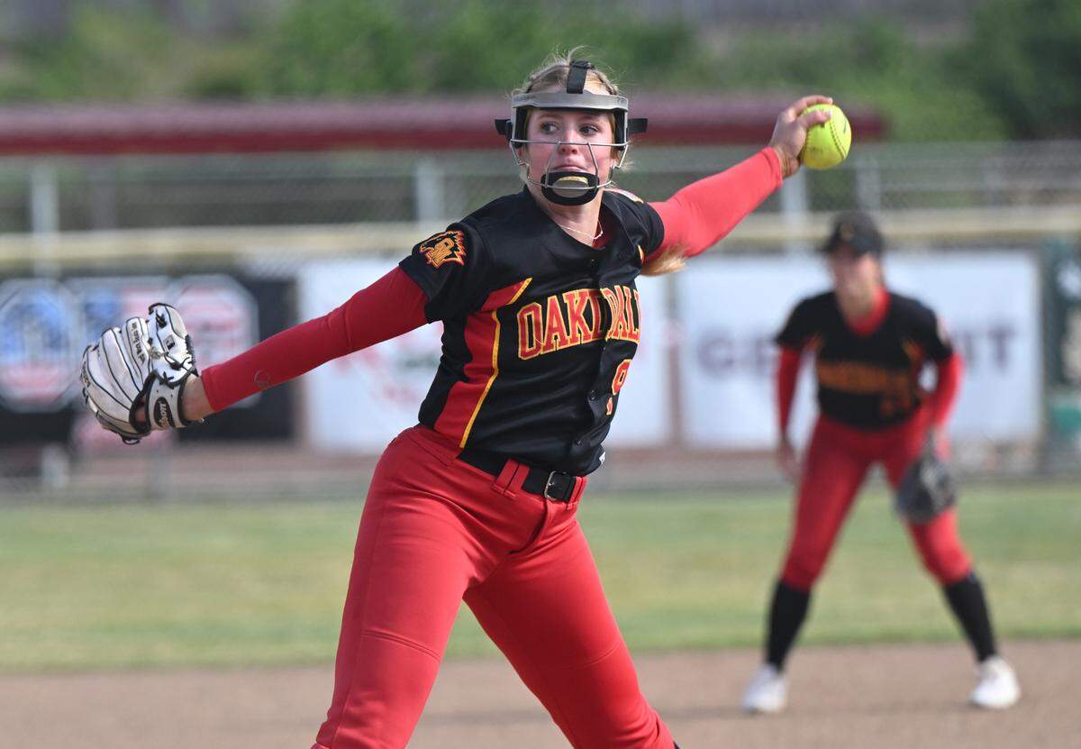 Oakdale’s Delainey Everett delivers a pitch during the Valley Oak League game with Kimball in Oakdale on May 4, 2023. 