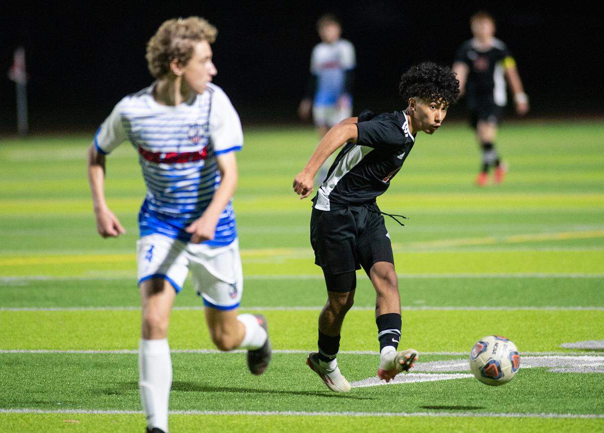 Modesto’s Adolfo Gonzalez passes the ball during the Sac-Joaquin section playoff game with Folsom at Downey High School in Modesto, Calif., on Thursday, Feb. 10, 2022. Modesto won the first-round game 3-0.