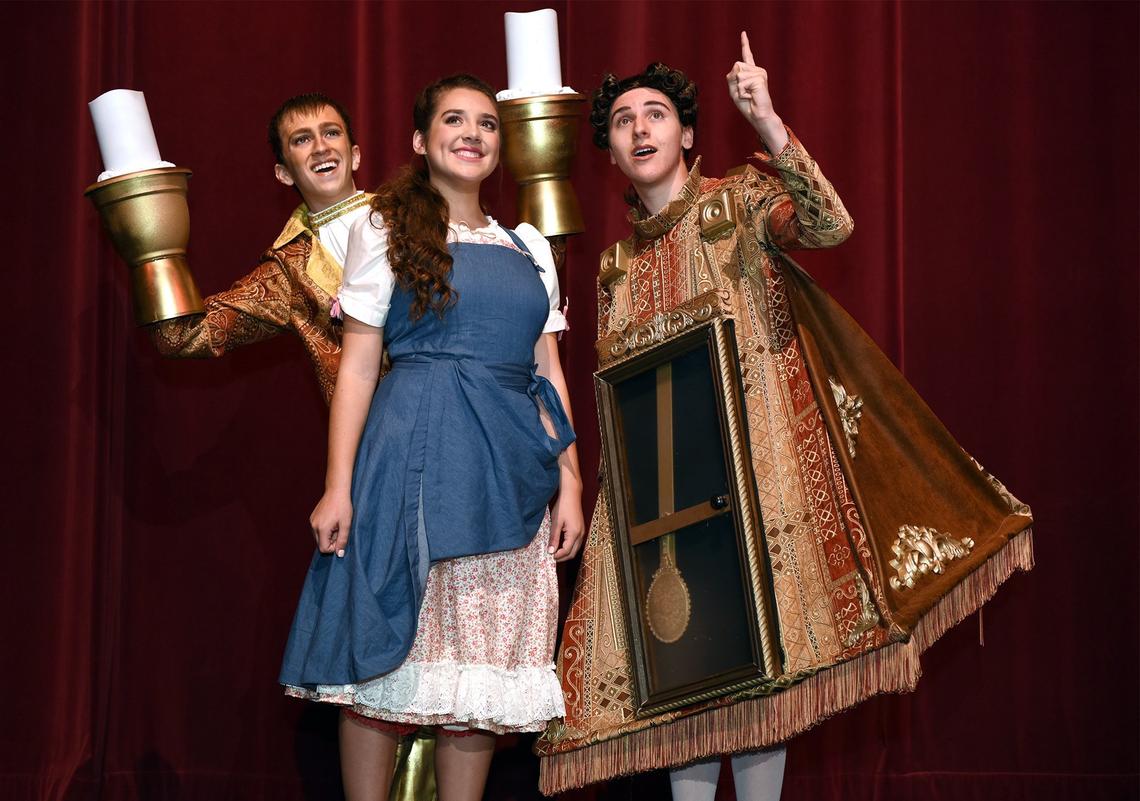 From left to right- David Torres (Lumiere), Leah Mello (Belle) and Daniel Vermeulen (Cogsworth) are pictured Tuesday July 10, 2018 as they prepare for the production Beauty & The Beast at Gallo Center For The Arts in Modesto, Calif. Beauty & The Beast is the YES Company’s 27th summer production.