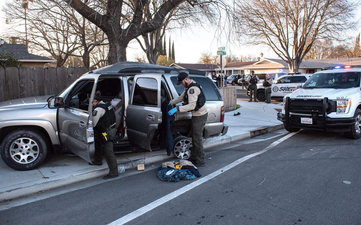 Stanislaus County Sheriff’s deputies investigate a vehicle after a pursuit and crash on Lakewood Avenue in Modesto, Calif., Wednesday, Feb. 22, 2023. The driver was arrested.