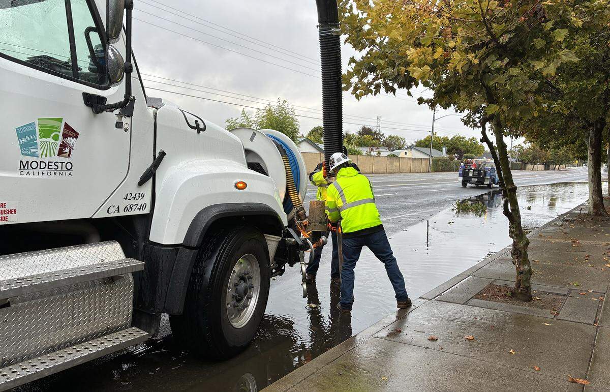 City crews work to unclog a rock well on Pelandale Avenue on Oct. 14, 2025.