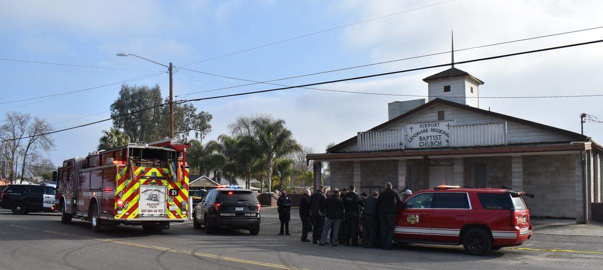 Modesto police work the scene of a fatal double shooting on Thrasher Avenue in the airport neighborhood on Tuesday afternoon, Dec. 21, 2021.