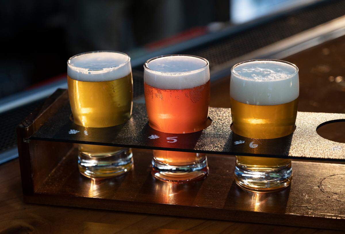 Small flight of beers, left to right, Tin Knocker (light ale), Sour Straws (kettle sour), and Monkey Nuts (Belgian strong ale) at Five Eye Brewing in Ceres, Calif., on Tuesday, Nov. 23, 2021.