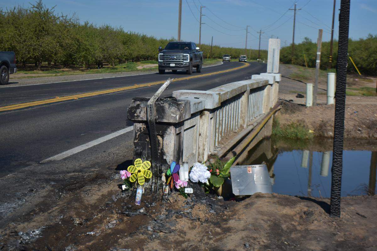 A memorial marks the  spot on the Oakdale-Waterford Highway where a crash killed four members of a family on March 8, 2026.