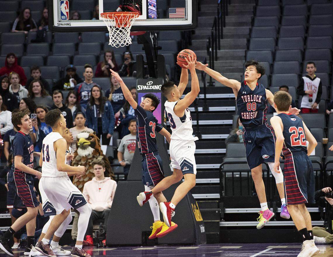 Turlock Christian’s Will Lu battles for a rebound with Vacaville Christian’s Luke Munar during the Sac-Joaquin Section Division VI boys basketball championship game at the Golden1 Center in Sacramento, Calif., Friday, Feb. 22, 2019.