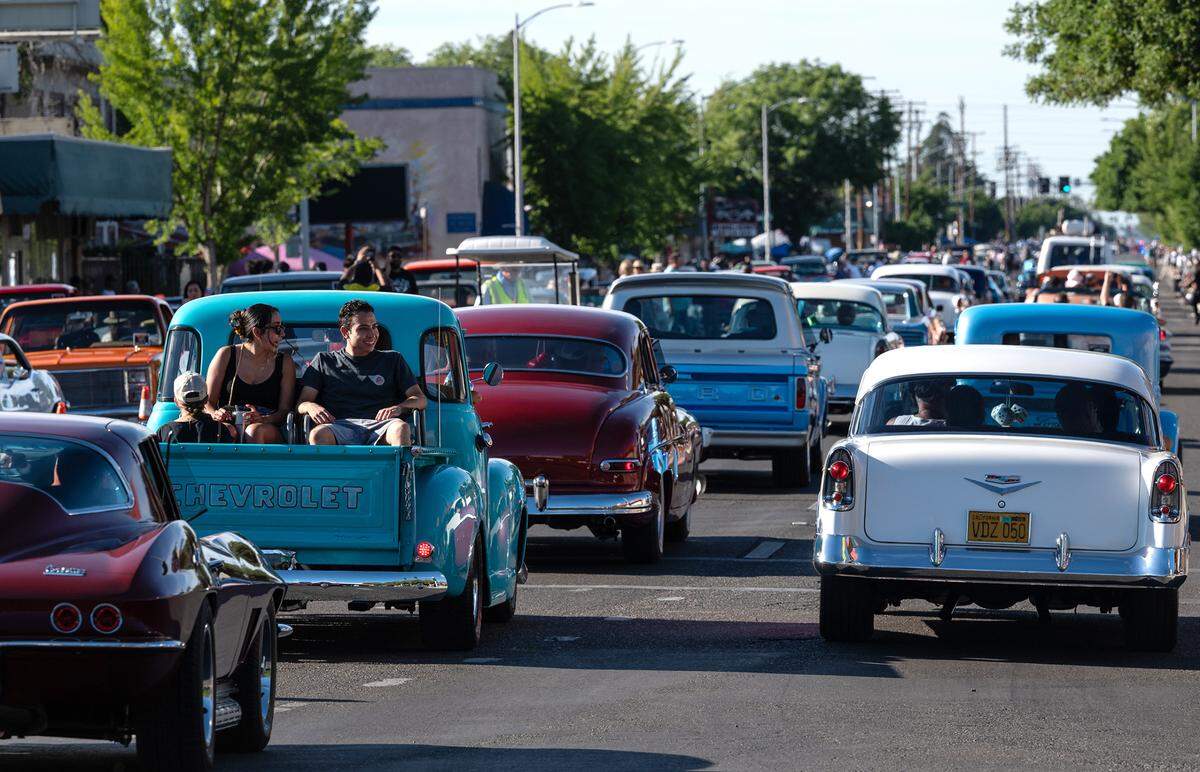 Classic car owners cruise along McHenry Avenue during the North Modesto Kiwanis Club’s “American Graffiti” car parade in Modesto, Calif., on Friday, June 10, 2022.